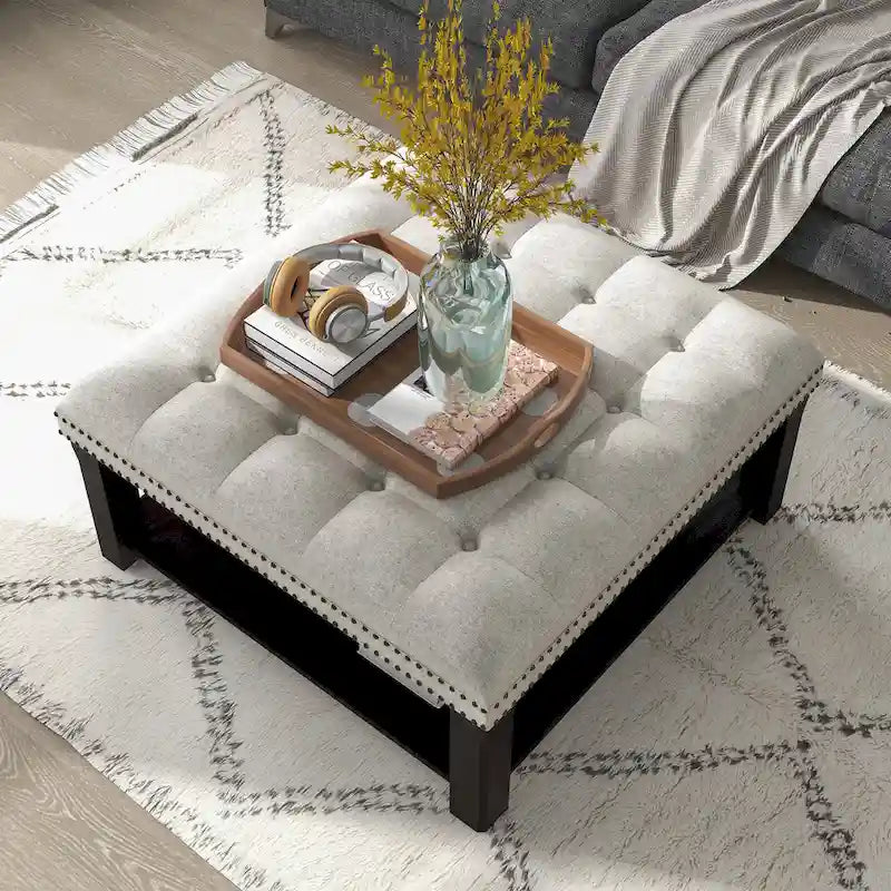 Pouf de rangement cocktail transitionnel en lin capitonné avec clous décoratifs